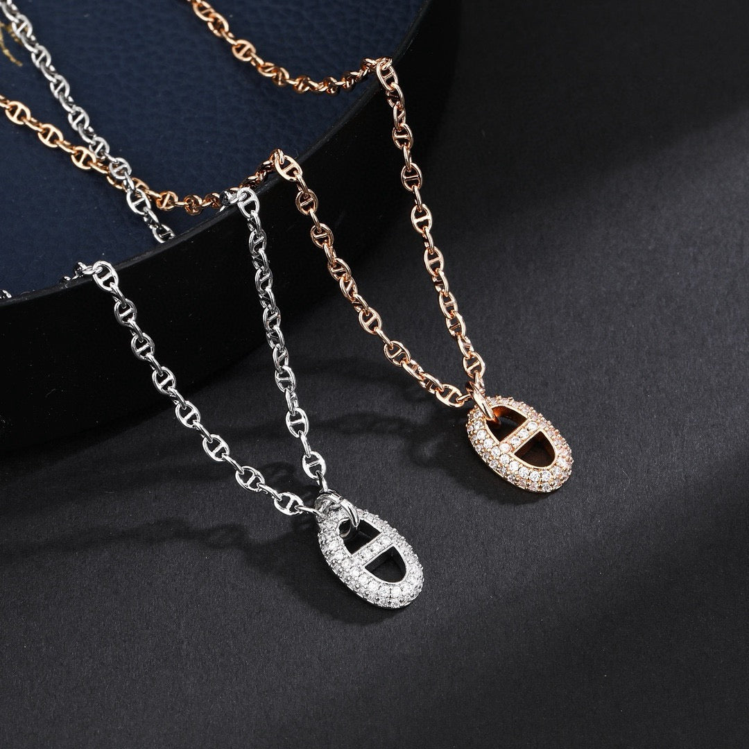 Hermès Silver and Rose Gold-Tone Anchor Pendant Necklace - album image 1