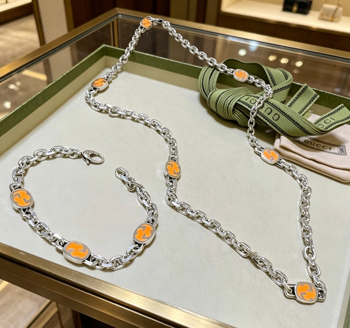 Gucci Silver-Tone Orange Enamel Jewelry Options - album image 1