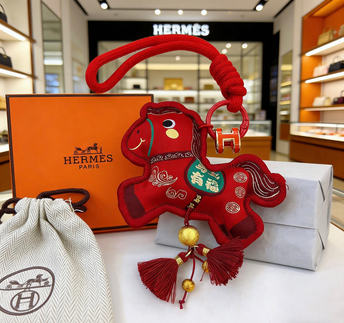 Hermès Red Flower-Charm Keychain with Red Braided Cord - album image 2