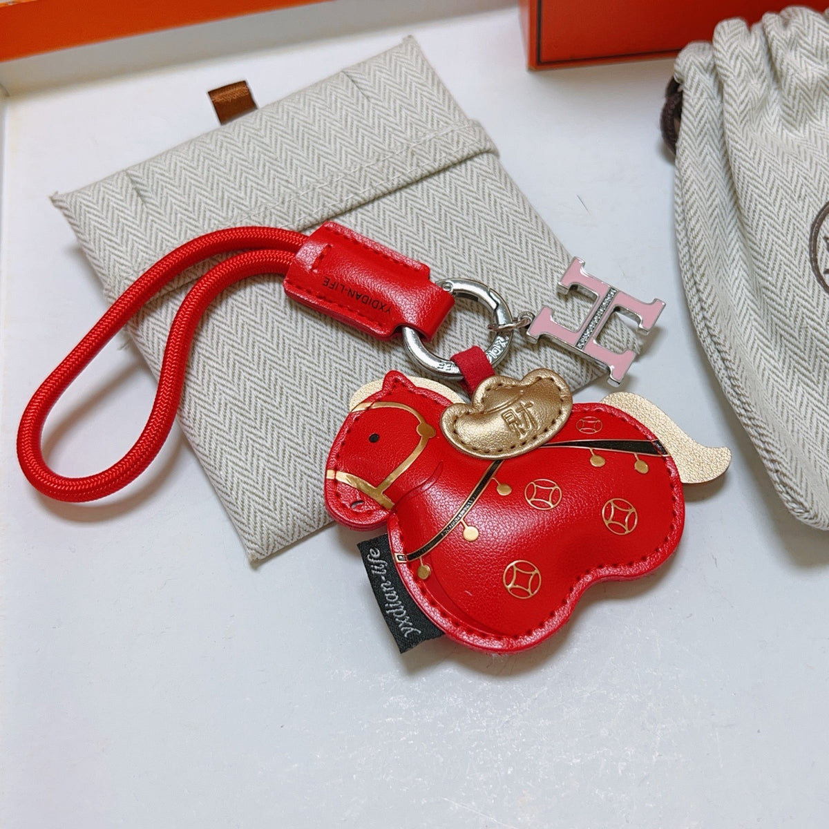 Hermès Red Flower-Charm Keychain with Red Braided Cord - album image 4