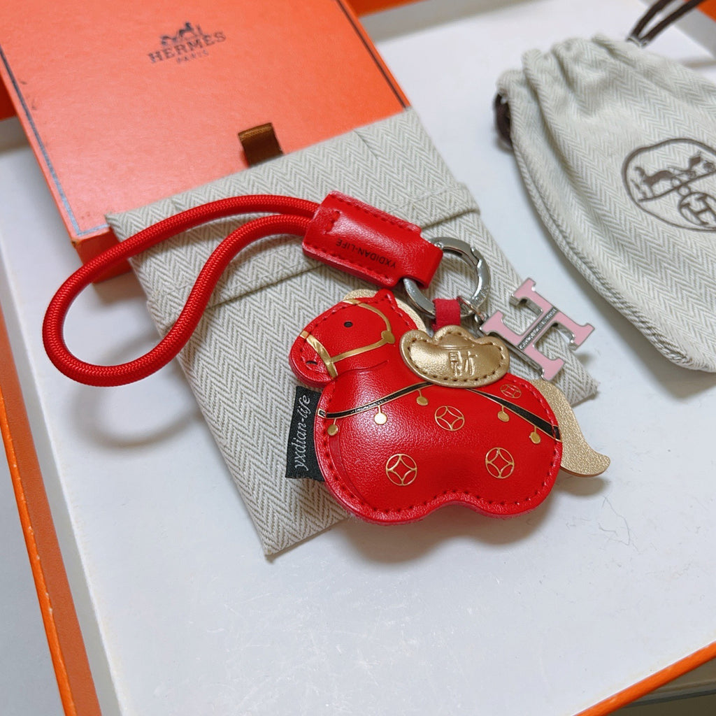 Hermès Red Flower-Charm Keychain with Red Braided Cord - album image 2