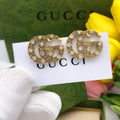 Gucci Interlocking G Gold-Tone Twisted Crystal Accent Earrings - album image 1