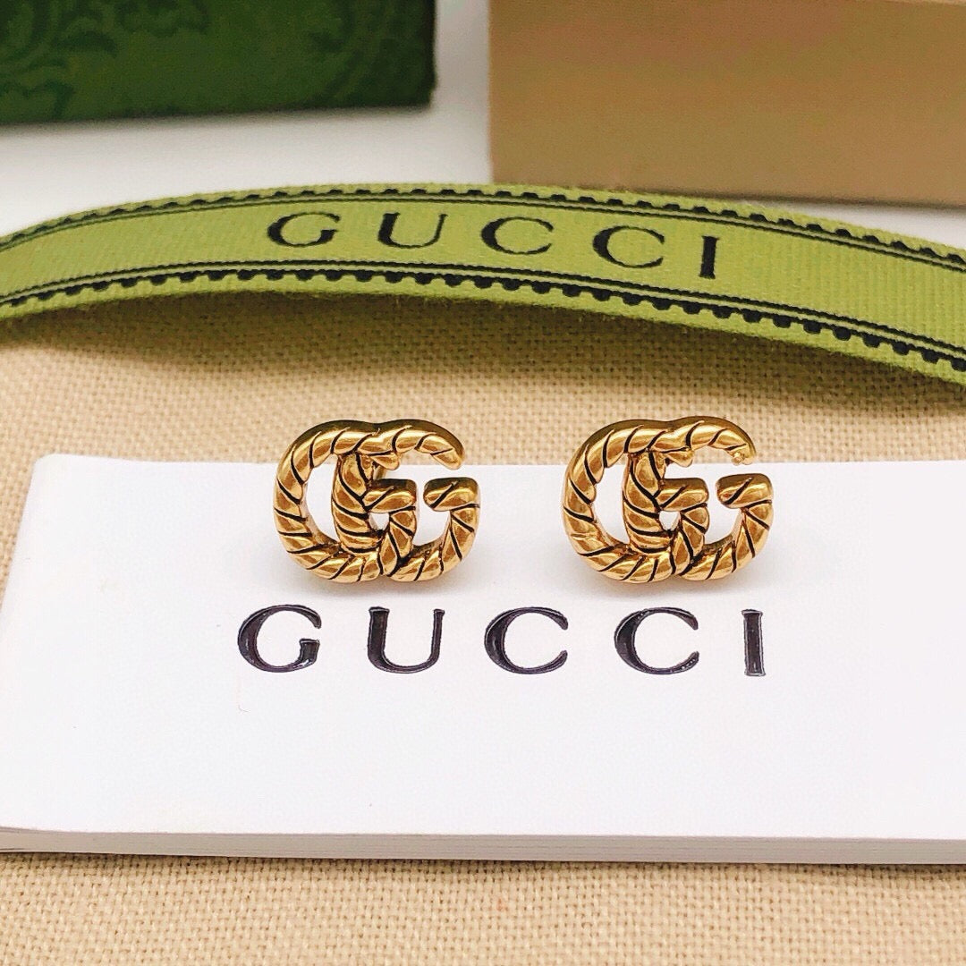Gucci Interlocking G Twisted Mini Earrings - album image 1
