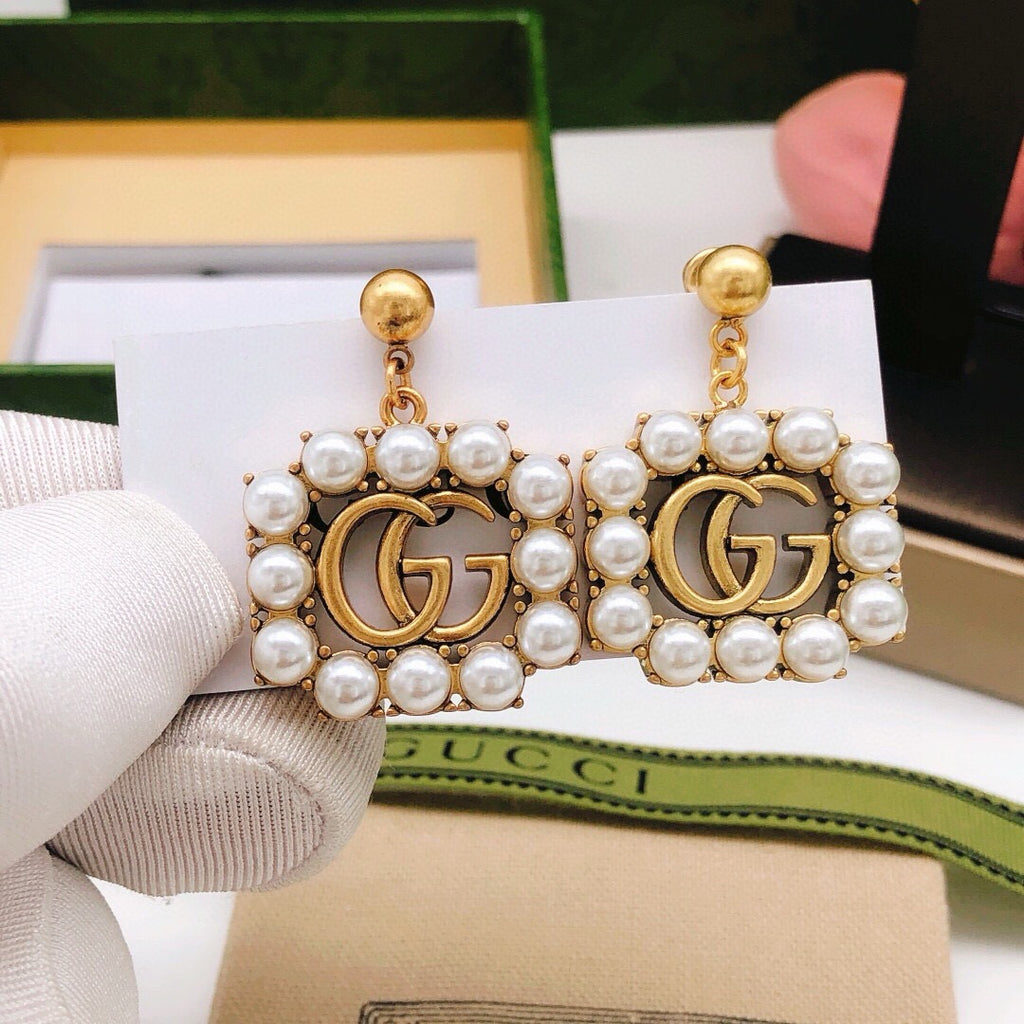 Gucci Pearl Tassel Earrings - album image 1