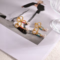 Dior Metallic Bow and Pearl-Look Earrings - product image 1