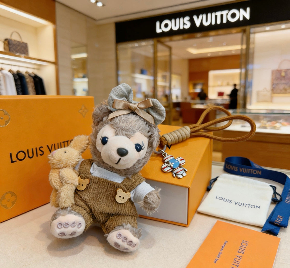 Louis Vuitton Gray Plush Character Keychain in Tan Outfit - album image 1