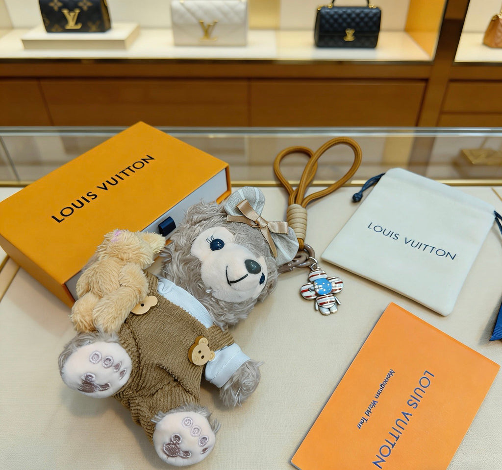 Louis Vuitton Gray Plush Character Keychain in Tan Outfit - album image 2