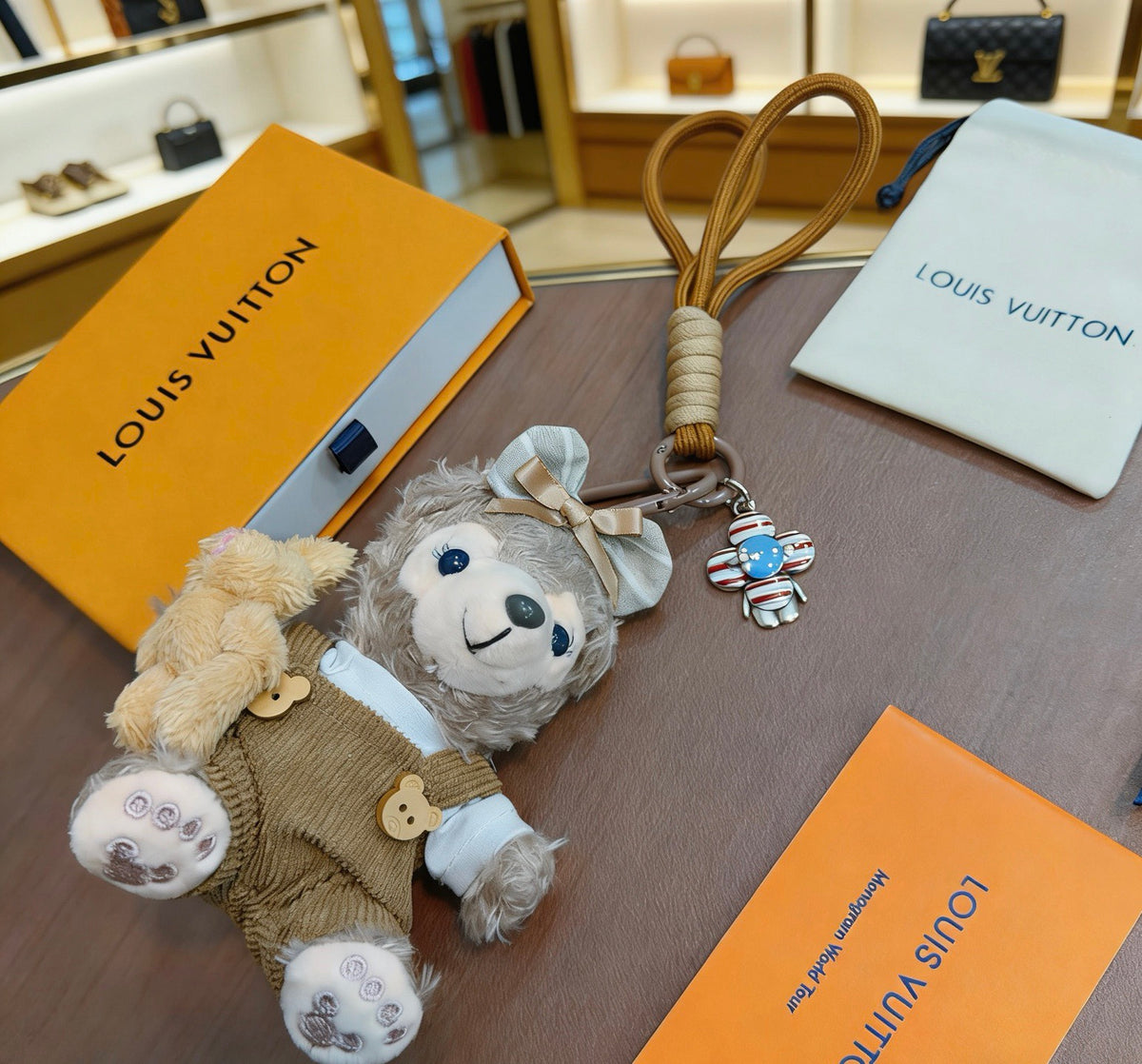 Louis Vuitton Gray Plush Character Keychain in Tan Outfit - album image 3