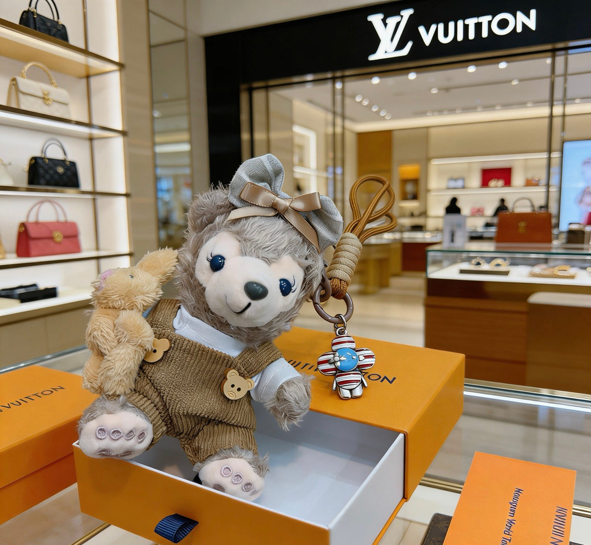 Louis Vuitton Gray Plush Character Keychain in Tan Outfit - album image 4