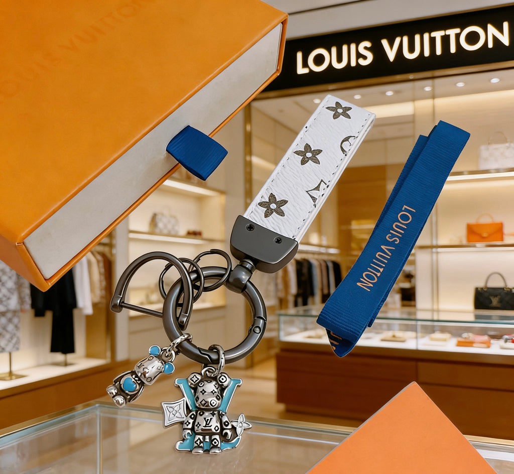 Louis Vuitton White Strap Keychain with Monogram Pendants - album image 1