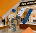 Louis Vuitton White Strap Keychain with Monogram Pendants - album image 1