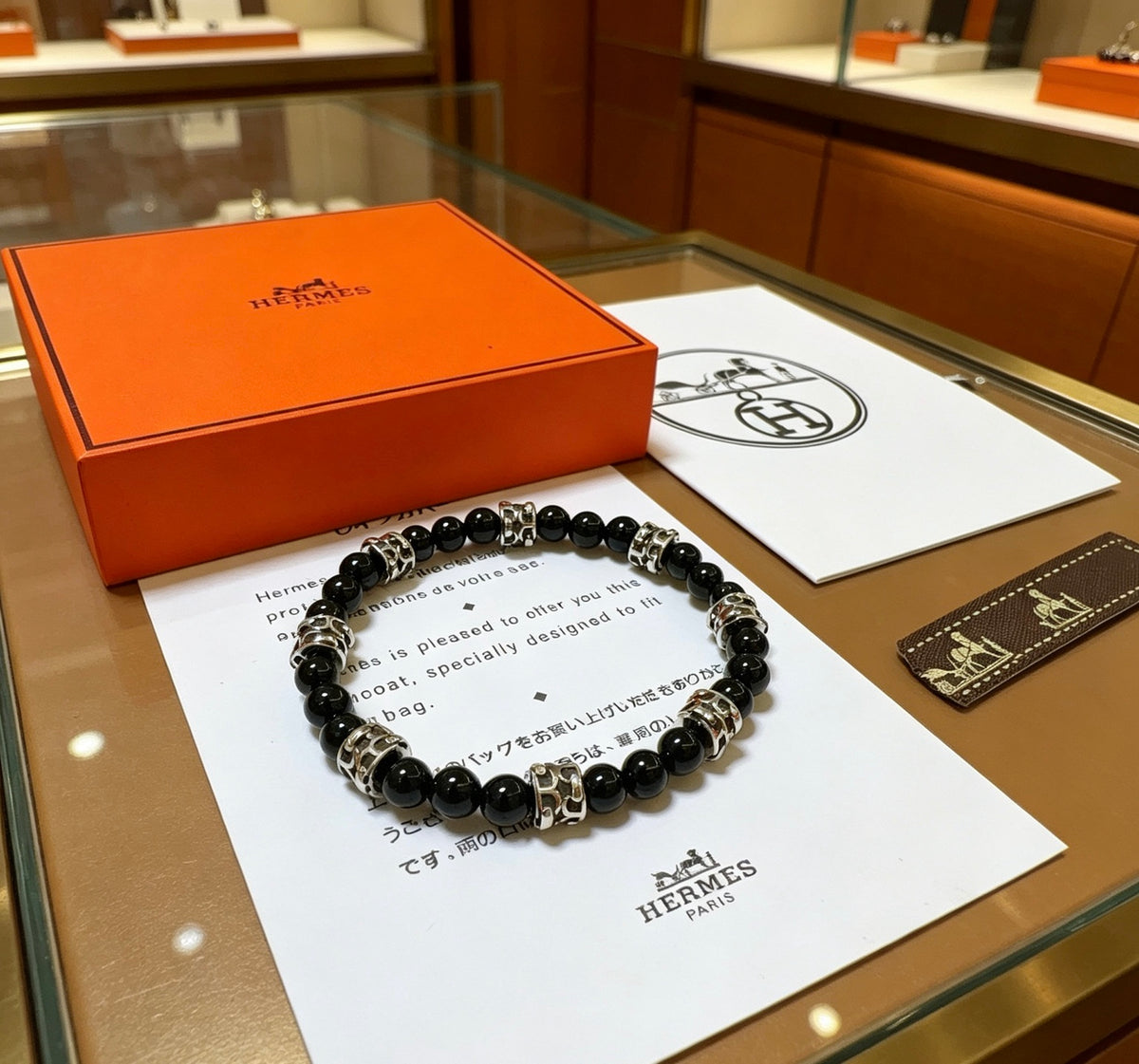 Hermès Black Bead Gold-Tone Anchor Charm Bracelet - album image 6