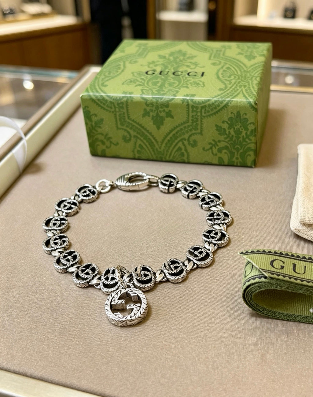 Gucci Silver-Tone GG Link Bracelet with G Charm - album image 1