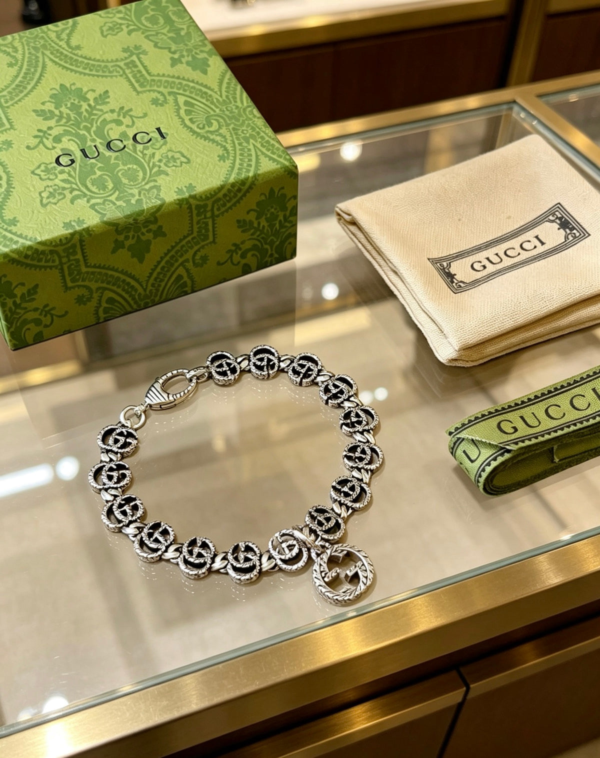 Gucci Silver-Tone GG Link Bracelet with G Charm - album image 9