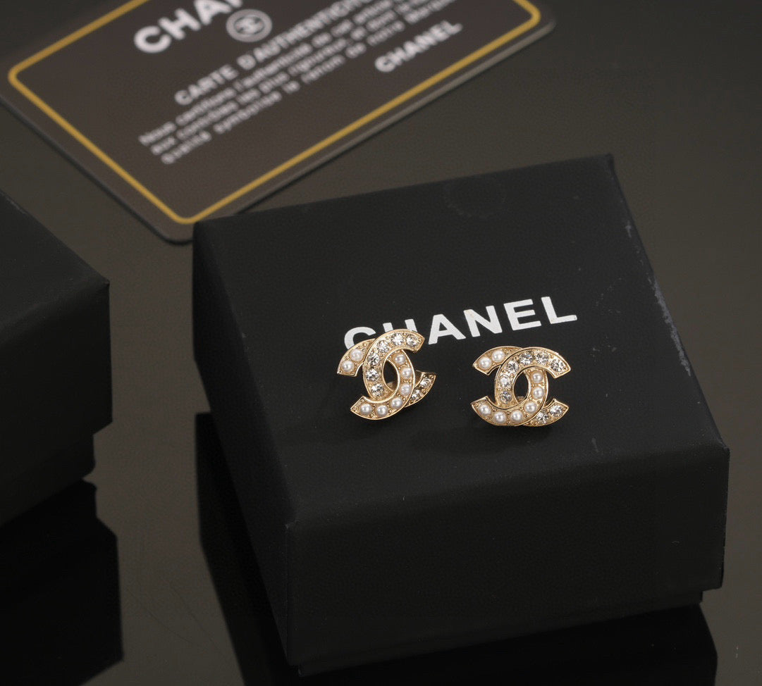 Chanel Interlocking C Stud Earrings - album image 1