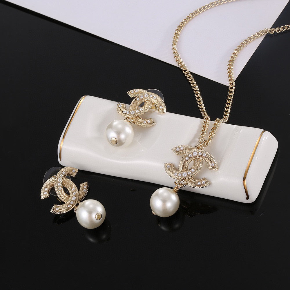 Chanel Interlocking C Pearl Circular Pendant Jewelry - Earrings or Necklace - album image 1