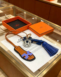 Hermès Tan Leather H Bag Charm with Blue Tassel - album image 1
