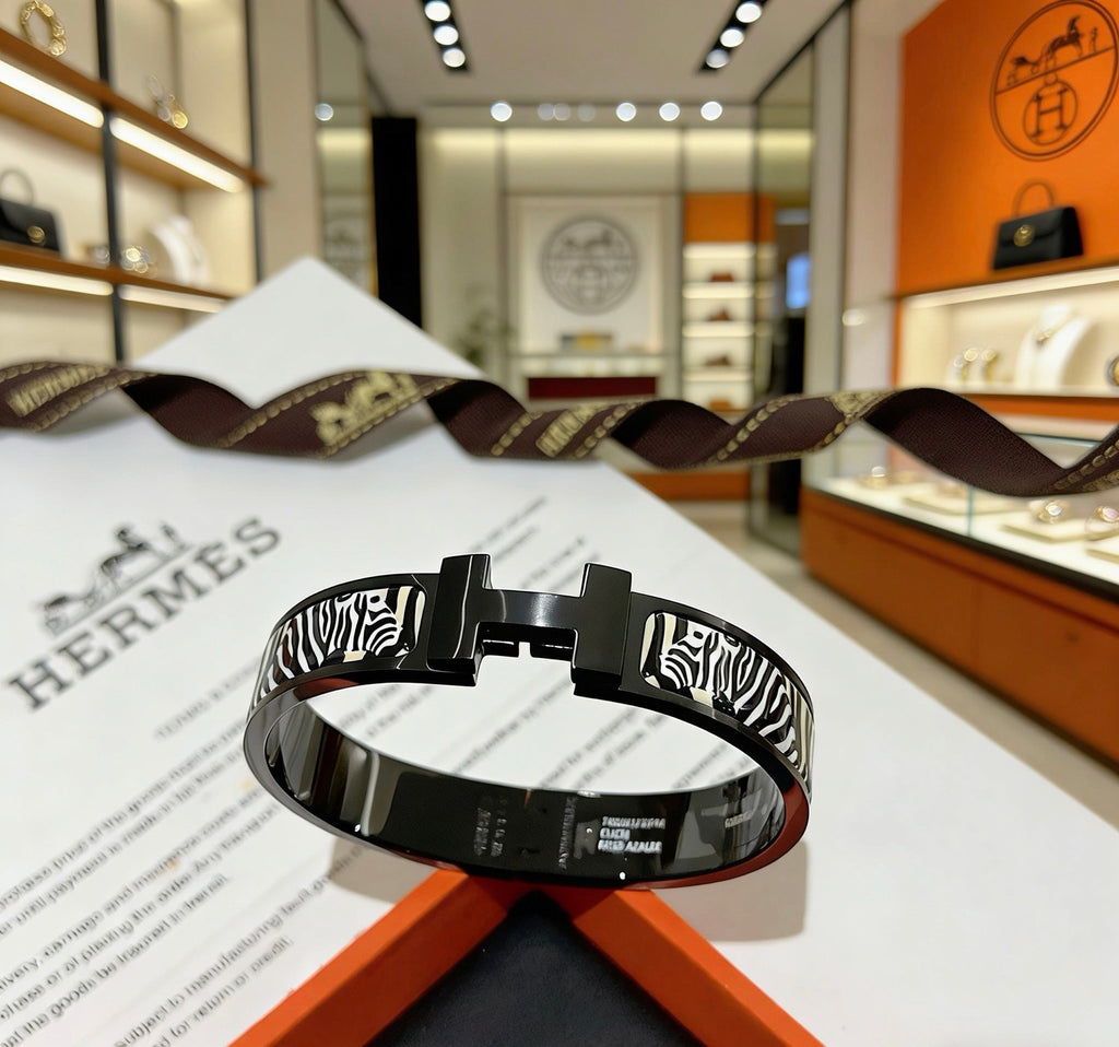 Hermès Gold-Tone Black Printed H-Clasp Bangle - album image 1