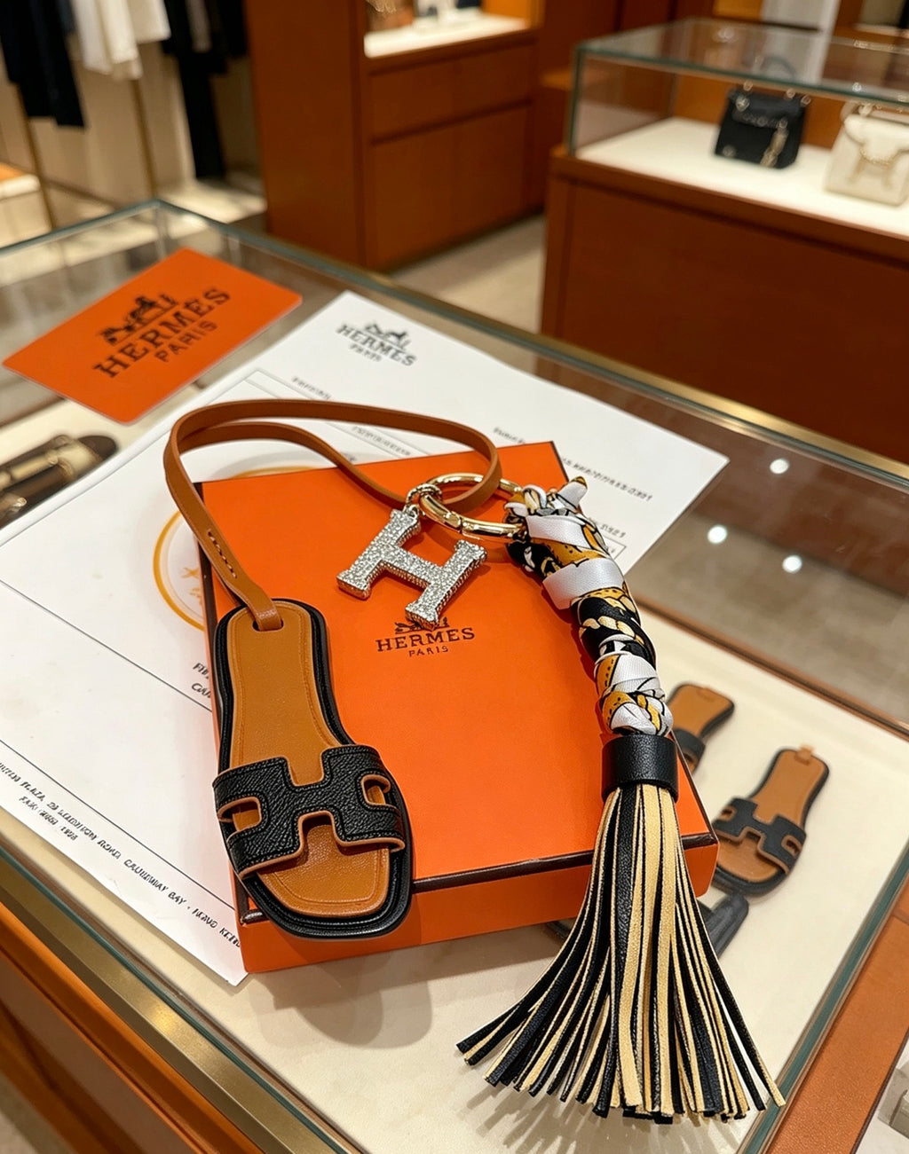 Hermès Tan Leather H Bag Charm with Black Tassel - album image 4