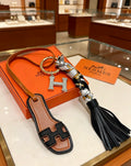 Hermès Tan Leather H Bag Charm with Black Tassel - album image 1