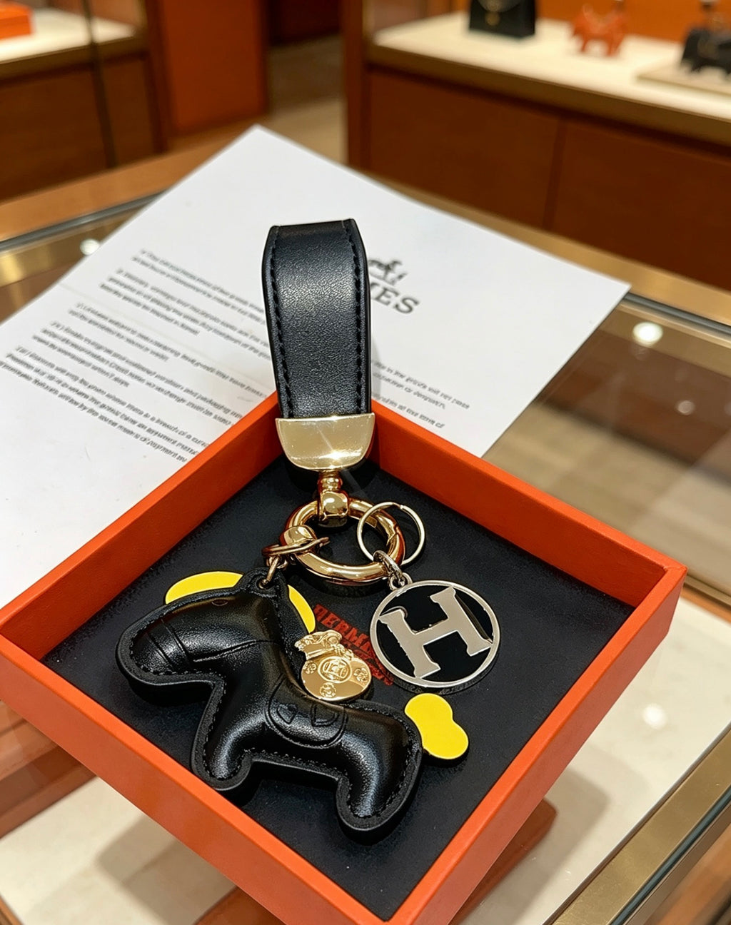 Hermès Black Horse and Gold-Tone H Charm Keychain - album image 1