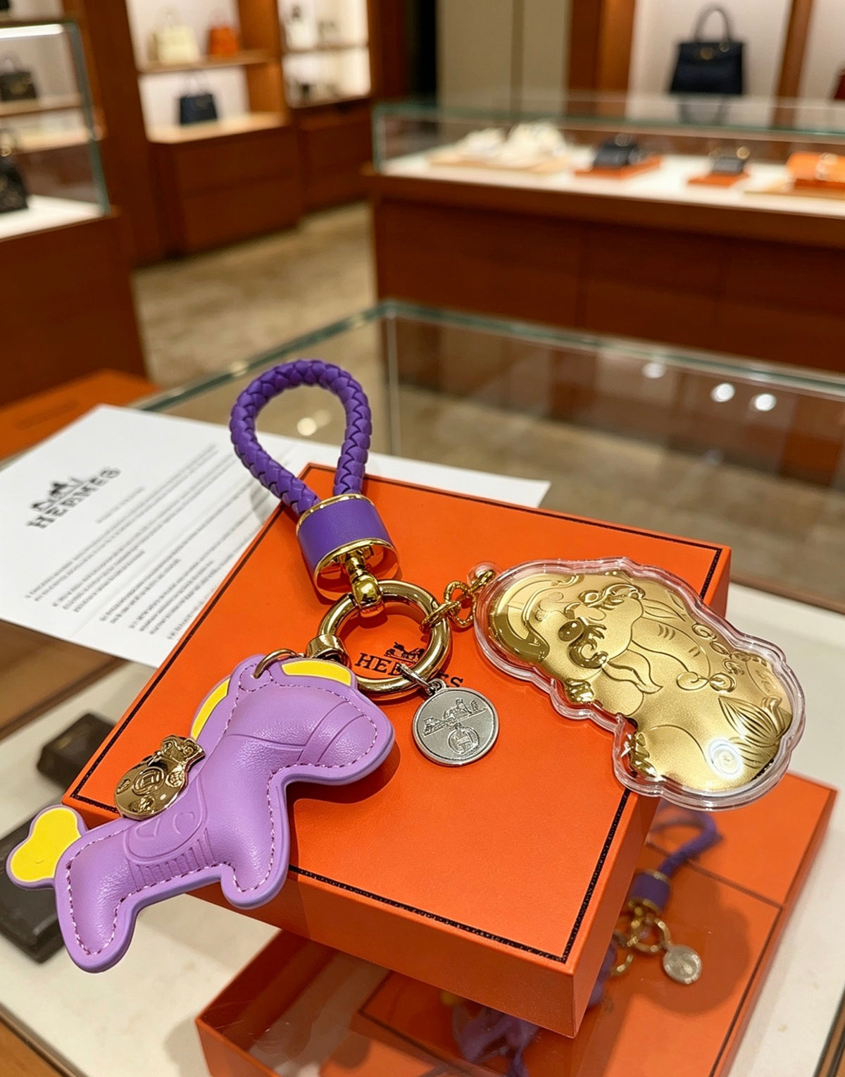Hermès Lavender Horse Keychain with Gold-Tone Charm and Purple Cord - album image 3