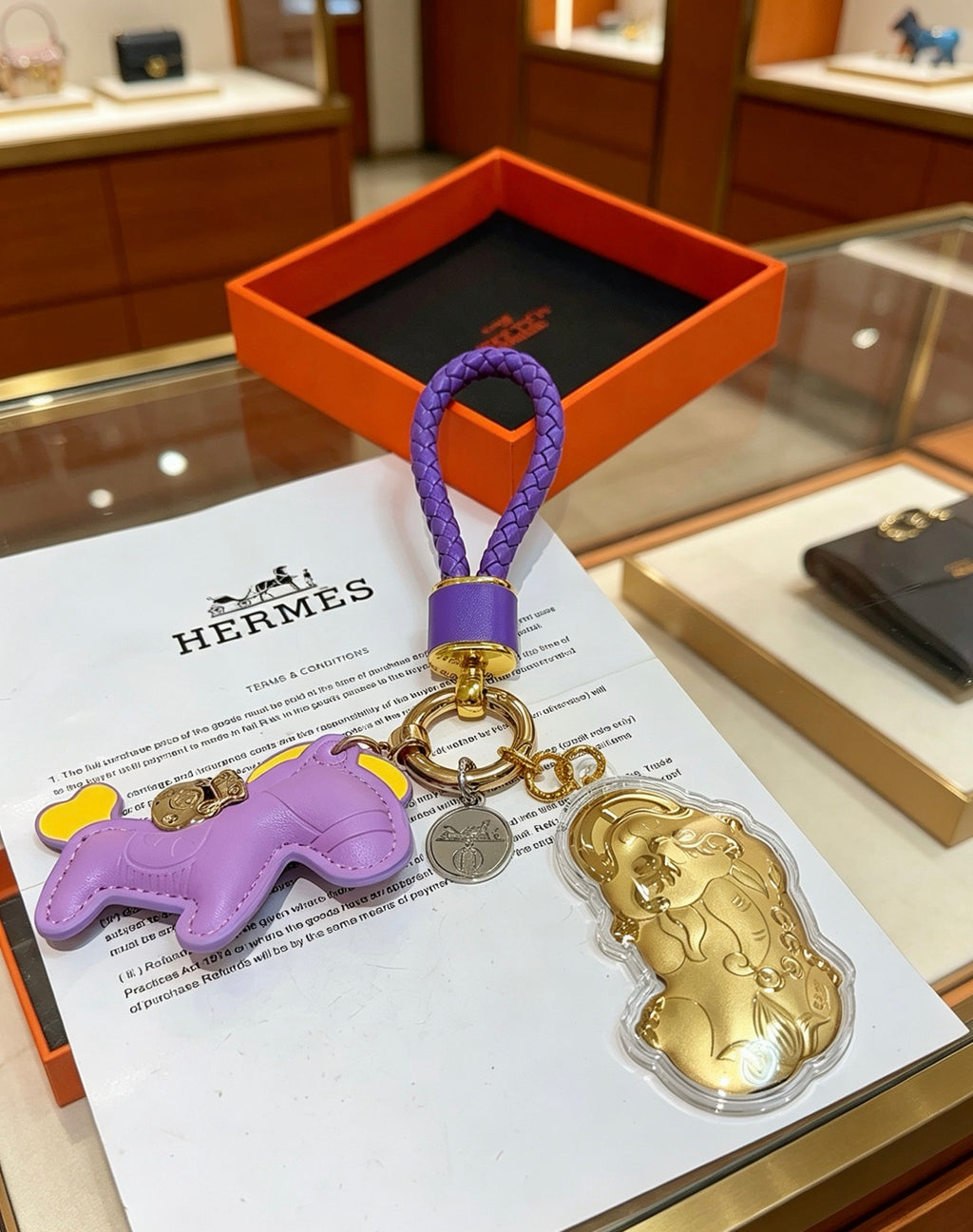Hermès Lavender Horse Keychain with Gold-Tone Charm and Purple Cord - album image 1