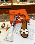 Hermès Tan Leather H Bag Charm with White Tassel - album image 1