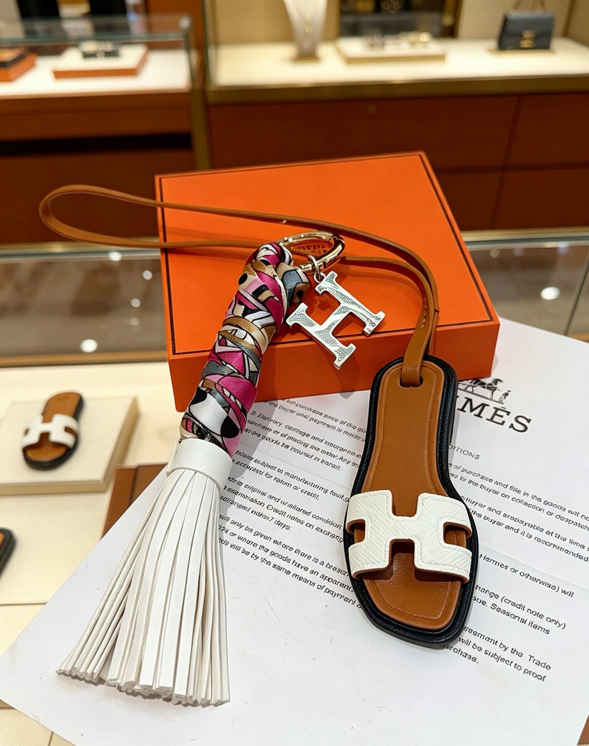 Hermès Tan Leather H Bag Charm with White Tassel - album image 1