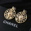 Chanel Gold-Tone Openwork Medallion Hoop Earrings - album image 1