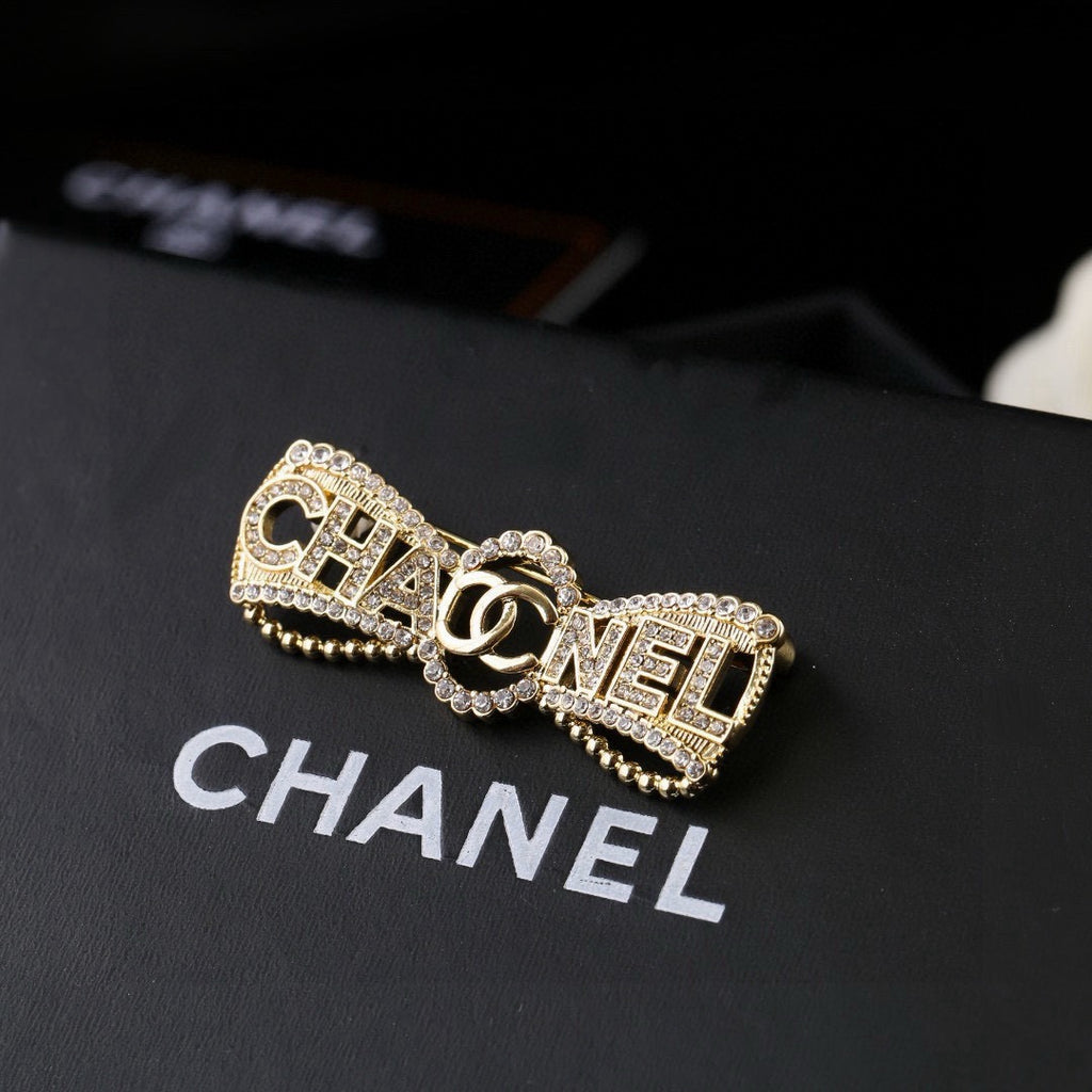 Chanel Interlocking C Bow Butterfly Crystal Accent Brooch - album image 1
