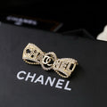 Chanel Interlocking C Bow Butterfly Crystal Accent Brooch - album image 1