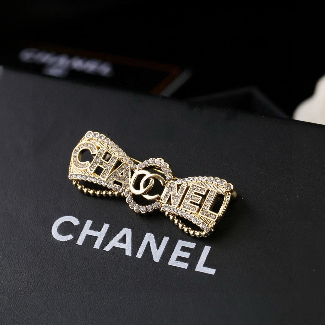 Chanel Interlocking C Bow Butterfly Crystal Accent Brooch - album image 1