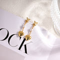 Louis Vuitton Gold-Tone LV and Flower Stud Earrings - album image 1