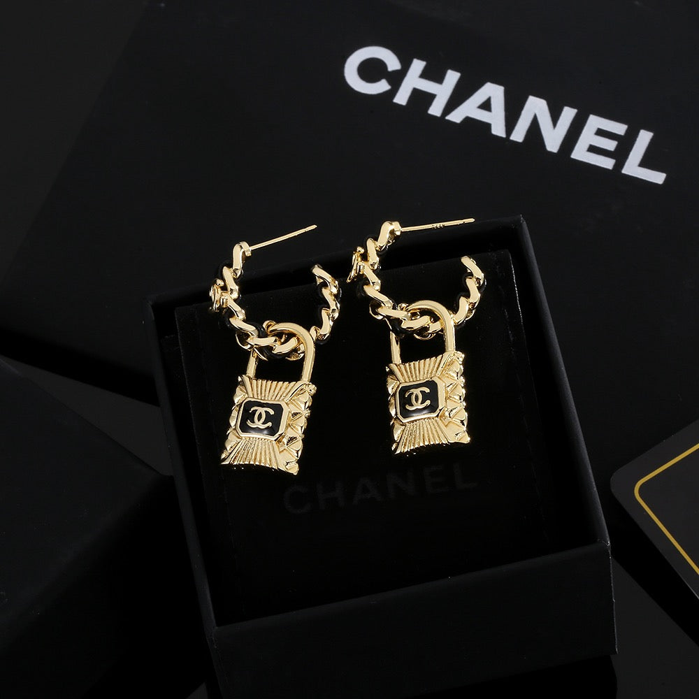 Chanel Interlocking C Resin Gold-Tone Stud Earrings - album image 1