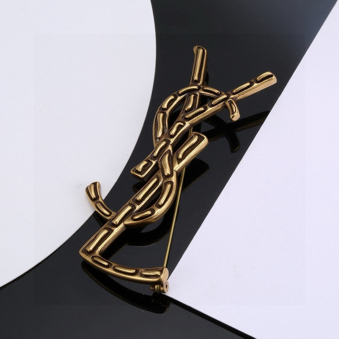 Saint Laurent Silver and Gold-Tone Twisted Monogram Brooch - album image 6