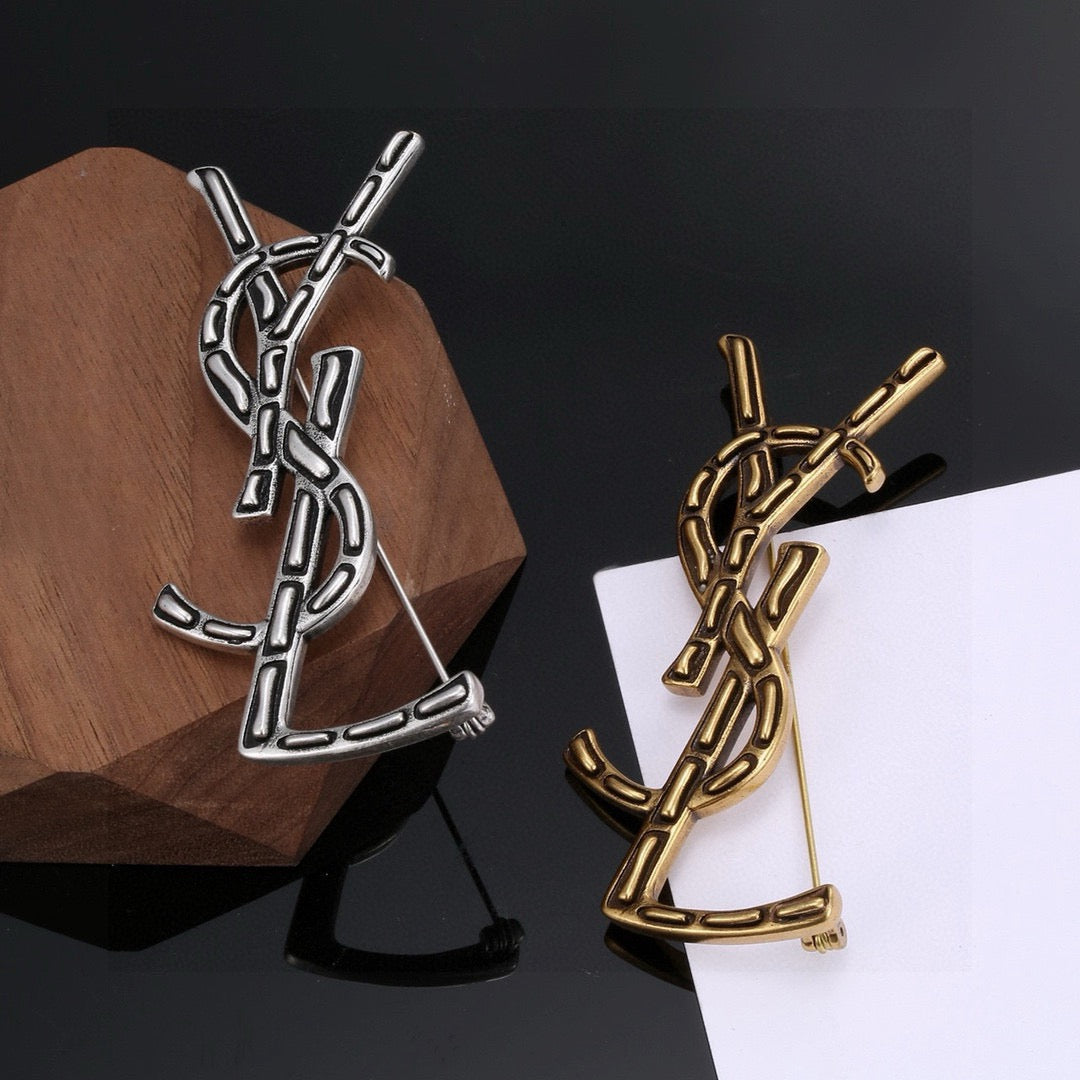 Saint Laurent Silver and Gold-Tone Twisted Monogram Brooch - album image 4