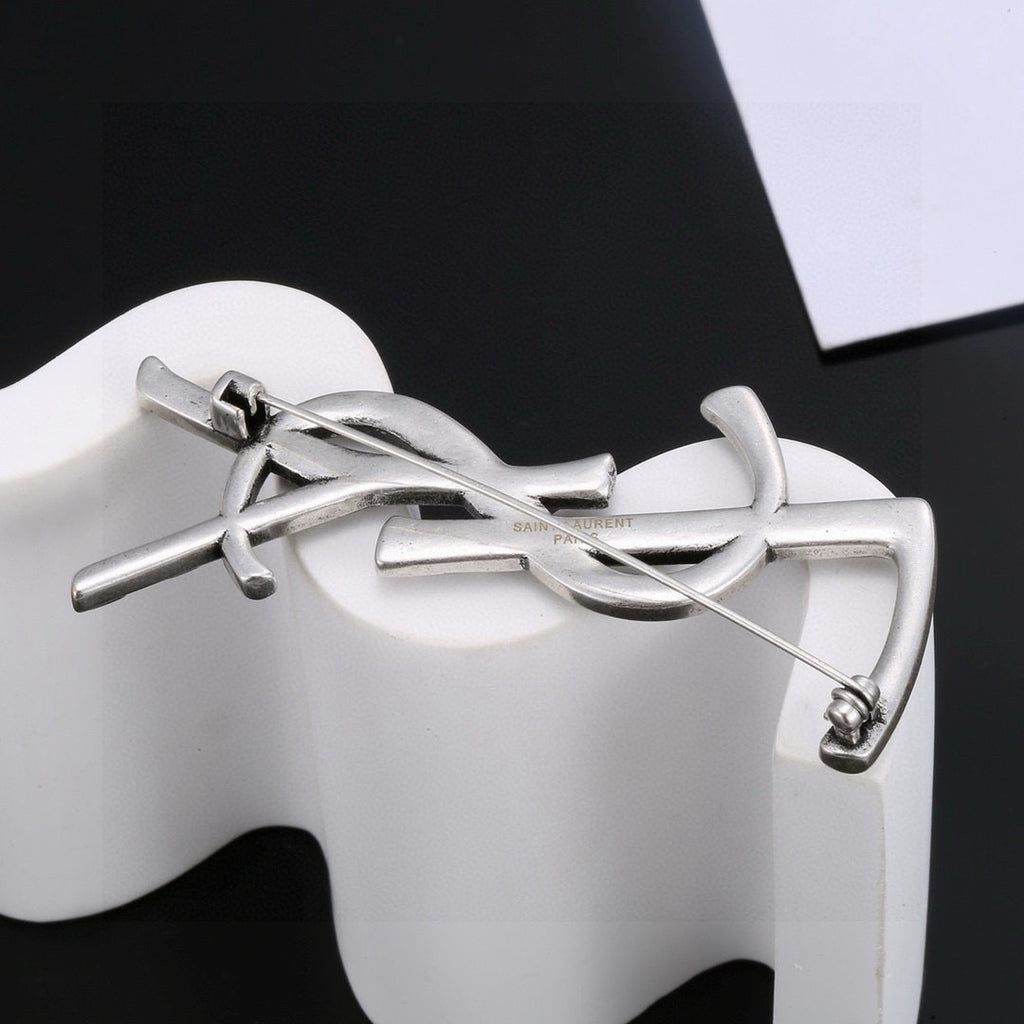 Saint Laurent Silver and Gold-Tone Twisted Monogram Brooch - album image 7
