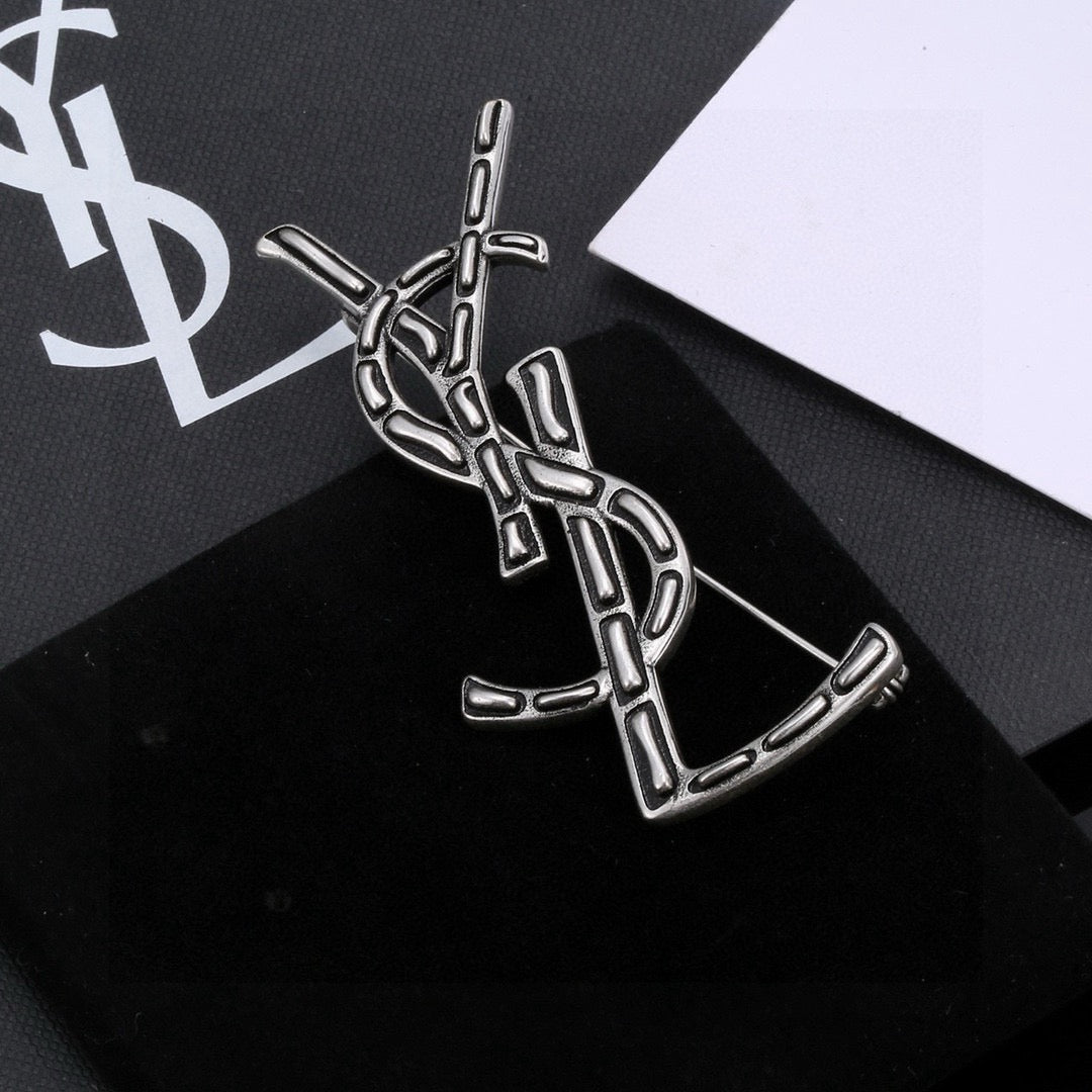 Saint Laurent Silver and Gold-Tone Twisted Monogram Brooch - album image 2