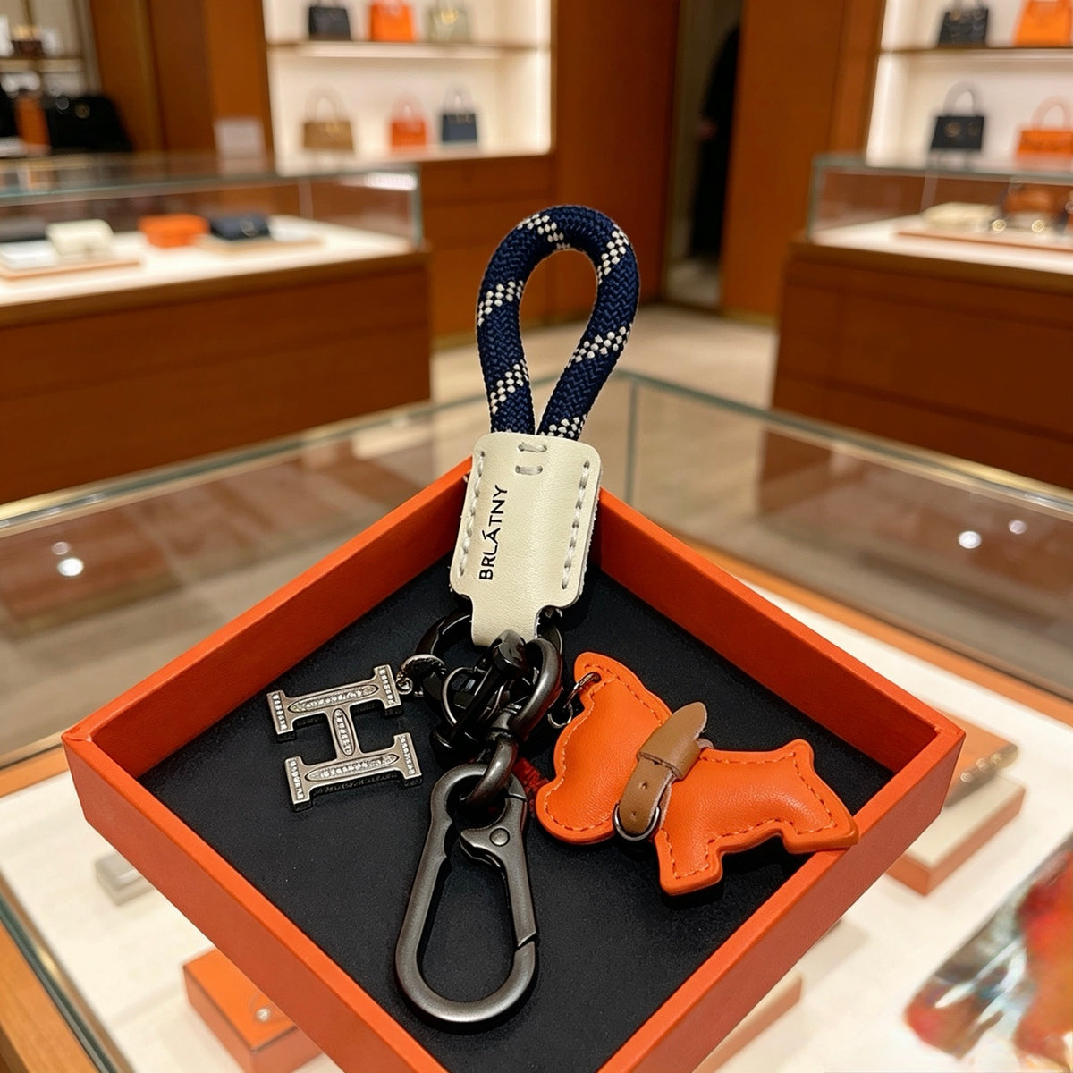Hermès Orange Horse and H-Charm Keychain with Navy Strap - album image 1
