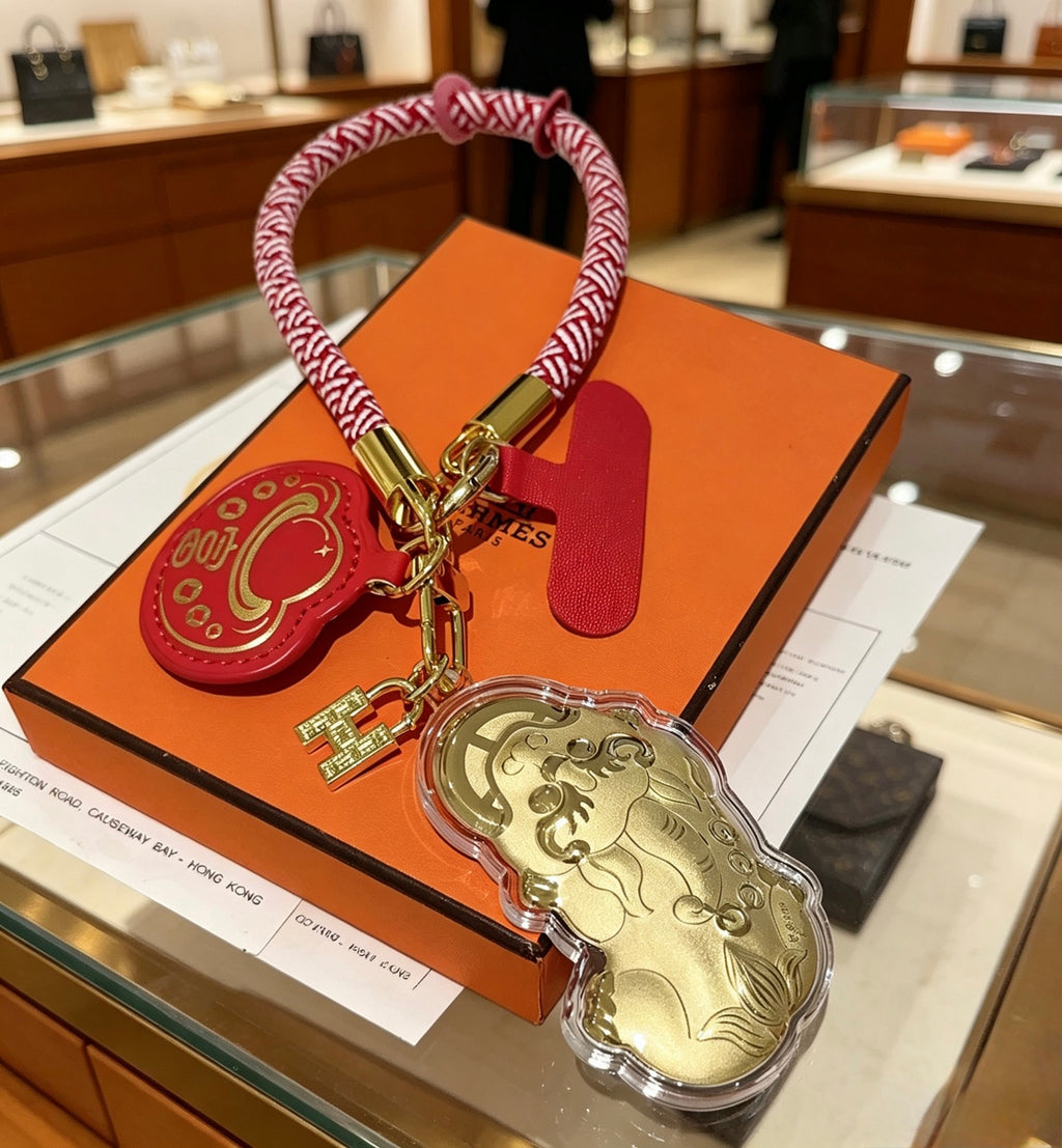 Hermès Gold-Tone Horse and Red H Disc Keychain with Pink Braided Cord - album image 4