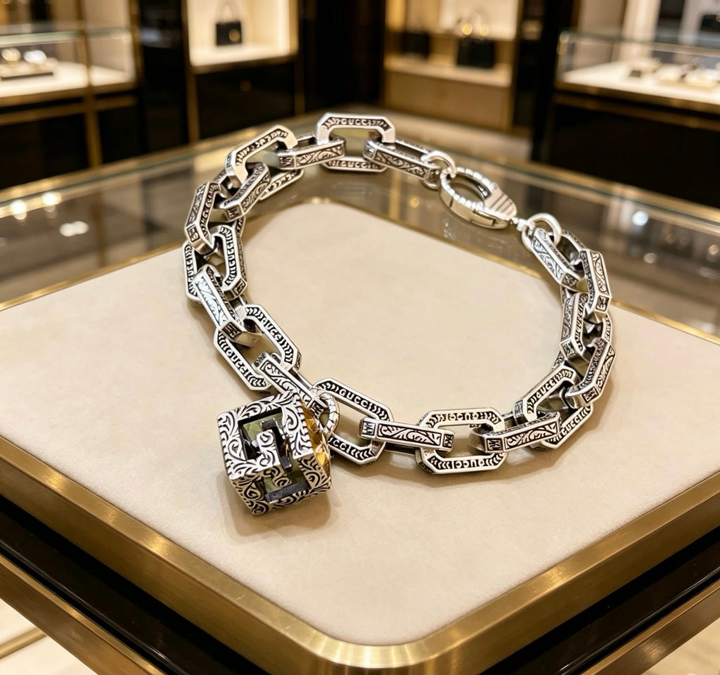 Gucci Silver-Tone Rectangular Link Bracelet with Cube Charm - album image 1