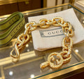 Gucci Gold-Tone Chunky Oval Link Bracelet with G Charm - album image 1