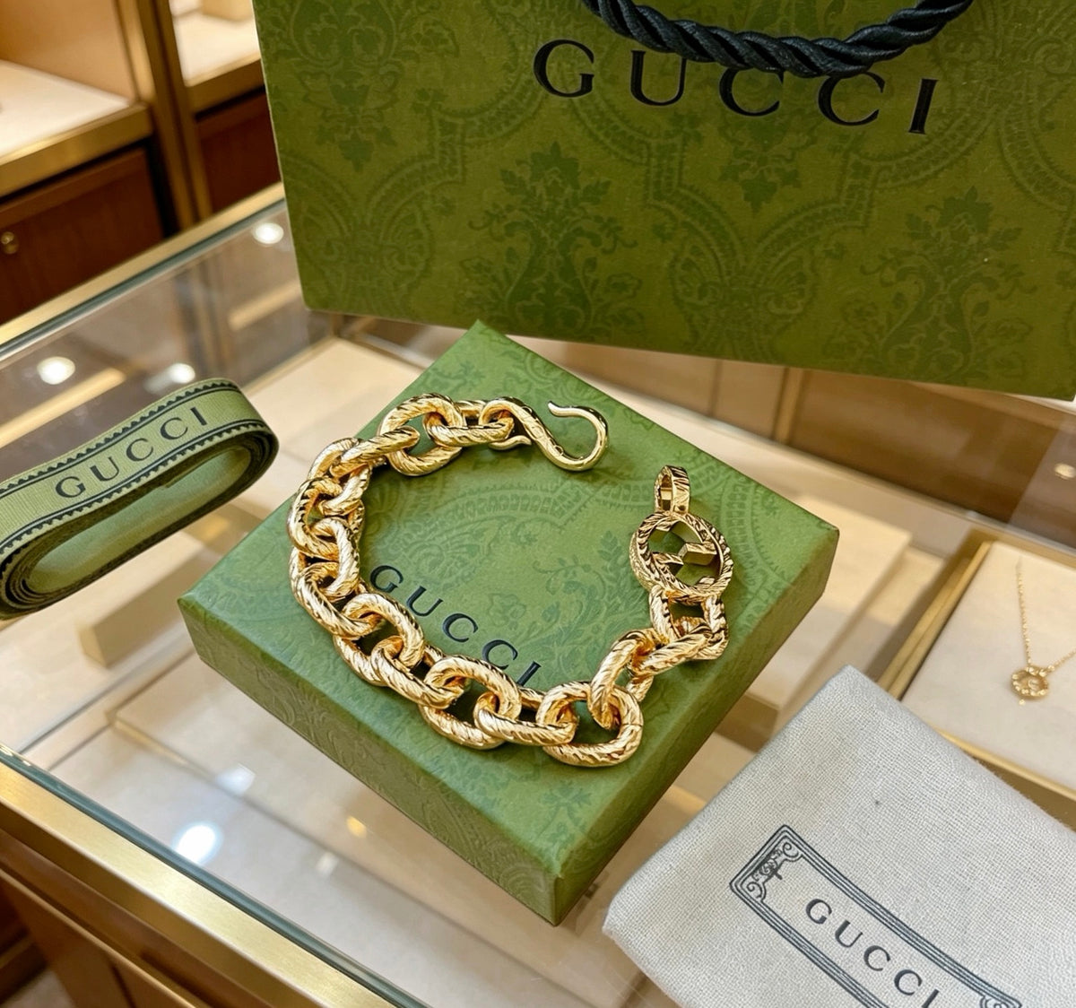 Gucci Gold-Tone Chunky Oval Link Bracelet with G Charm - album image 8