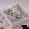 Dior Silver-Tone Folded Ribbon Earrings - product image 1
