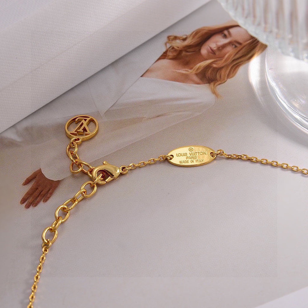 Louis Vuitton Gold-Tone Flower and Oval Charm Necklace - album image 1