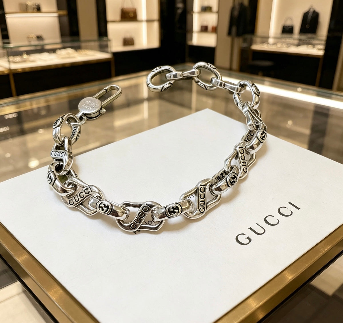 Gucci Silver-Tone Twisted Oval Link Bracelet - album image 1