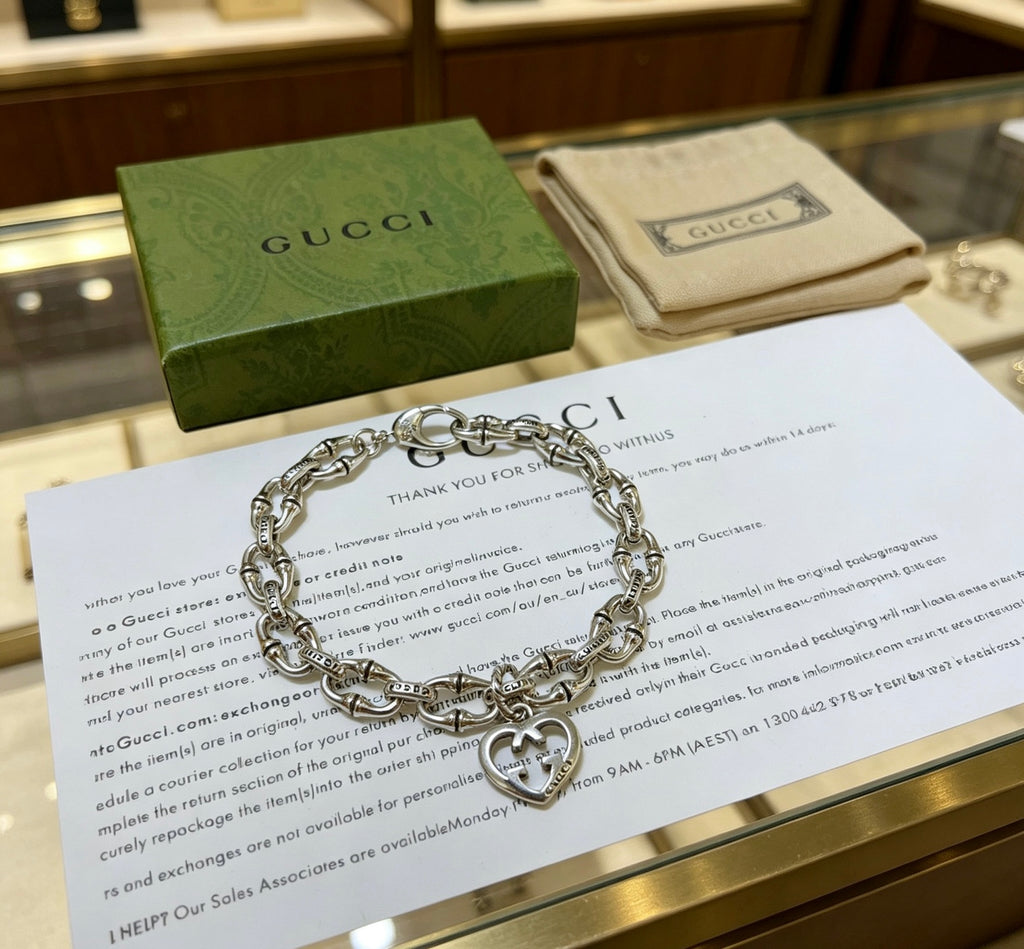 Gucci Silver-Tone Openwork Oval Link Bracelet with G Charm - album image 8