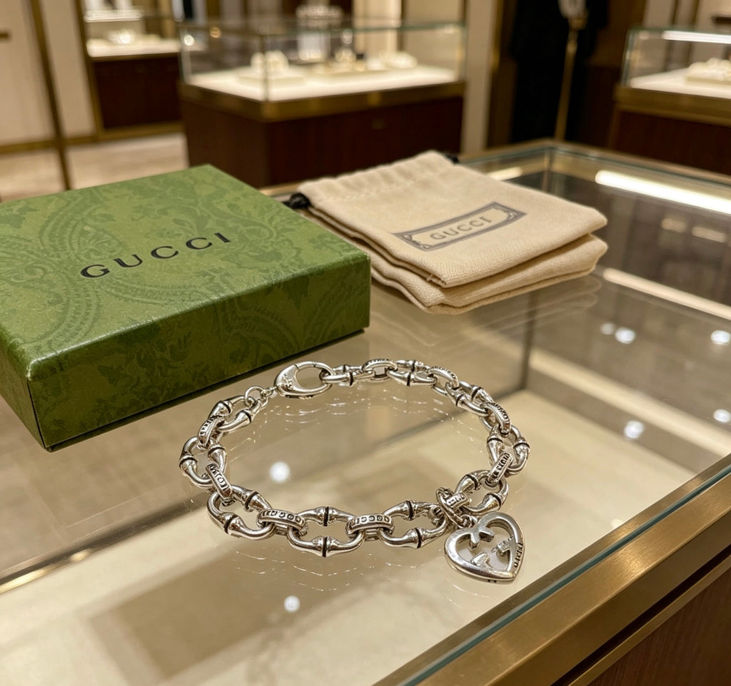 Gucci Silver-Tone Openwork Oval Link Bracelet with G Charm - album image 7