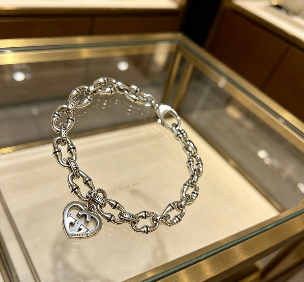 Gucci Silver-Tone Openwork Oval Link Bracelet with G Charm - album image 2